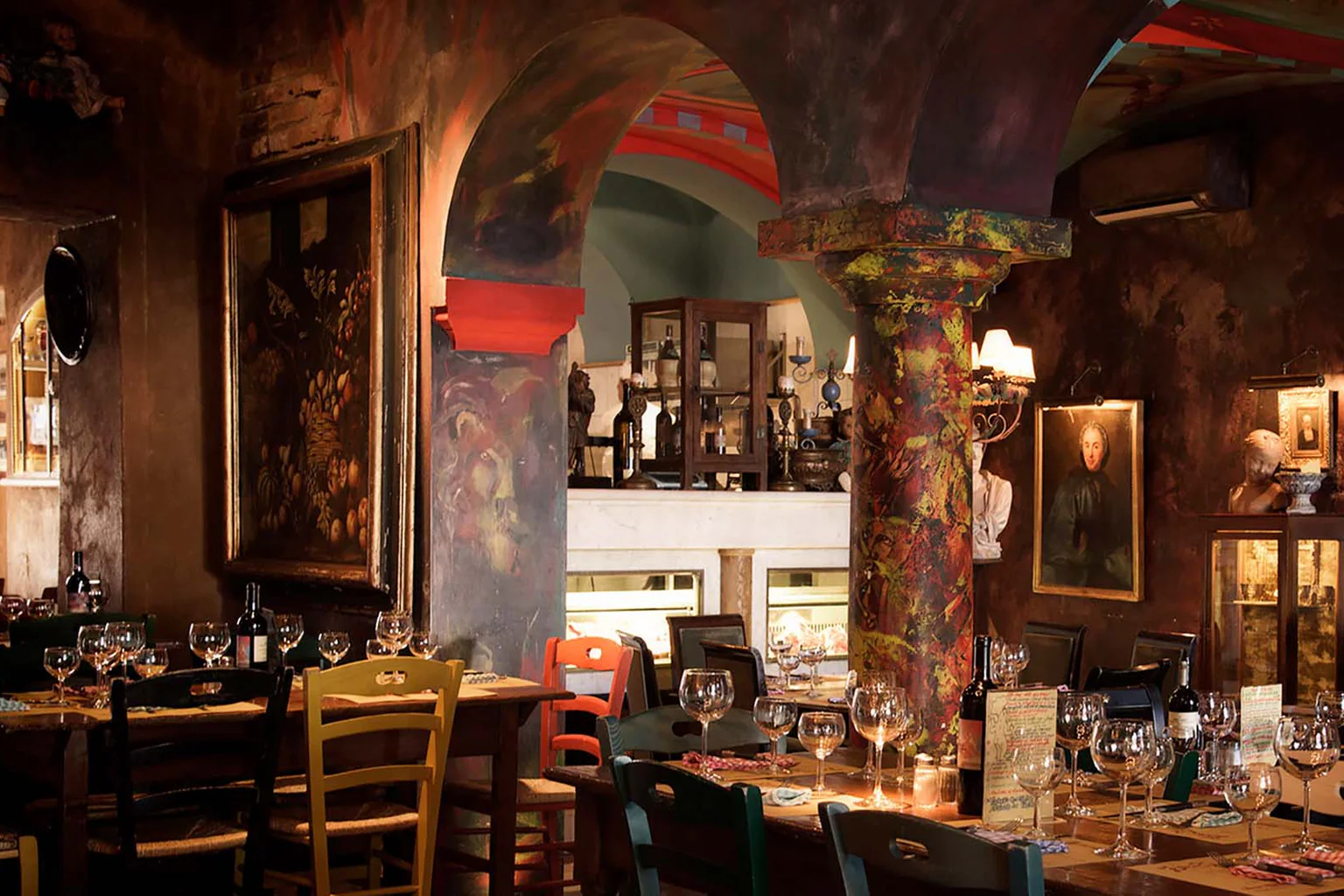 A warm, crowded dining room inside Trattoria Zà Zà in Florence.