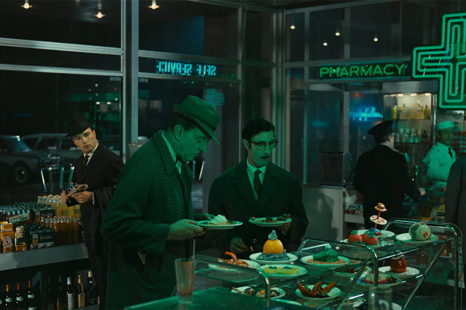 A meticulously composed modern interior crowded with people in Jacques Tati’s PlayTime.