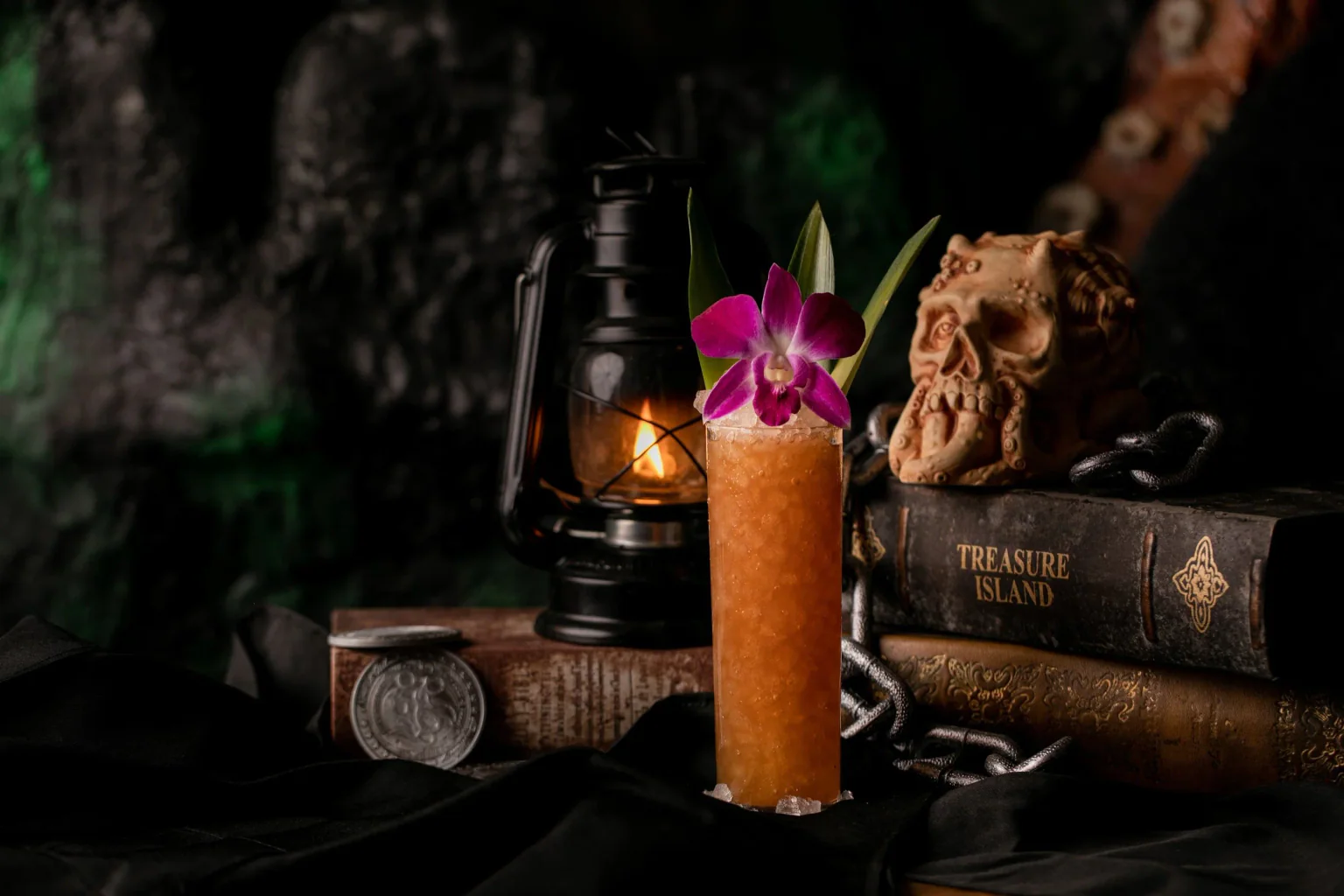 A tropical cocktail, rope, maps, and maritime objects at Strong Water Anaheim.