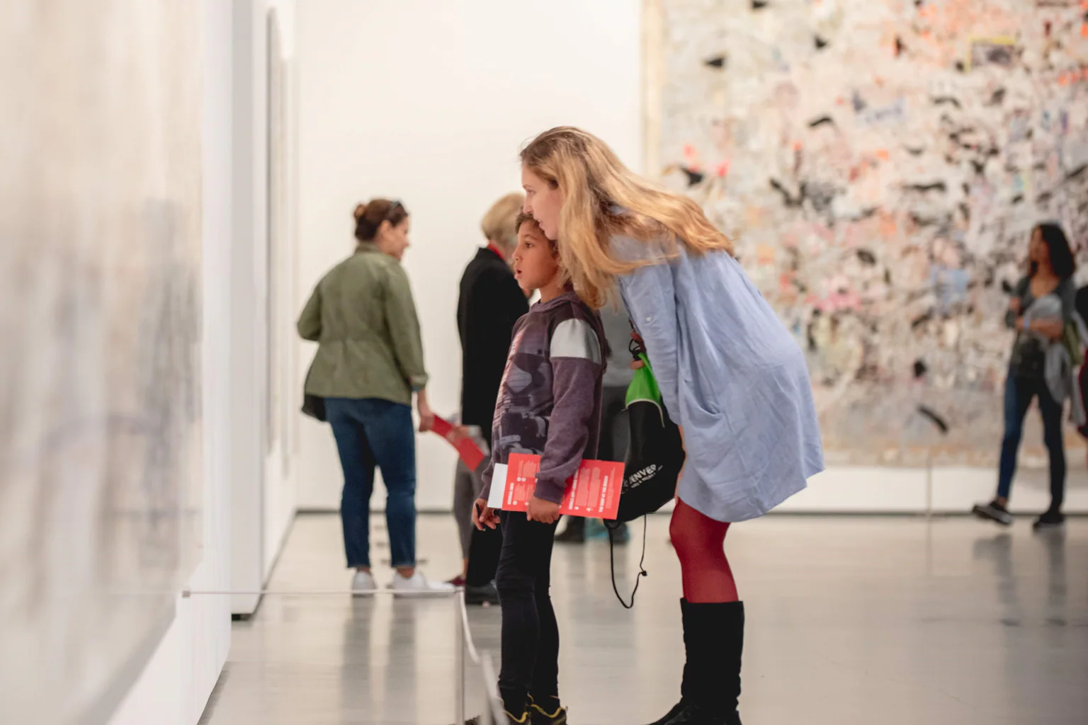 Visitors moving through The Broad’s white honeycomb exterior and entrance plaza in Los Angeles.